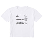 White cropped T-shirt featuring black text and hand-drawn icons celebrating three mountain essentials: pie, French fries, and “Ski Till I Die,” finished with the signature Double Diamond shield.