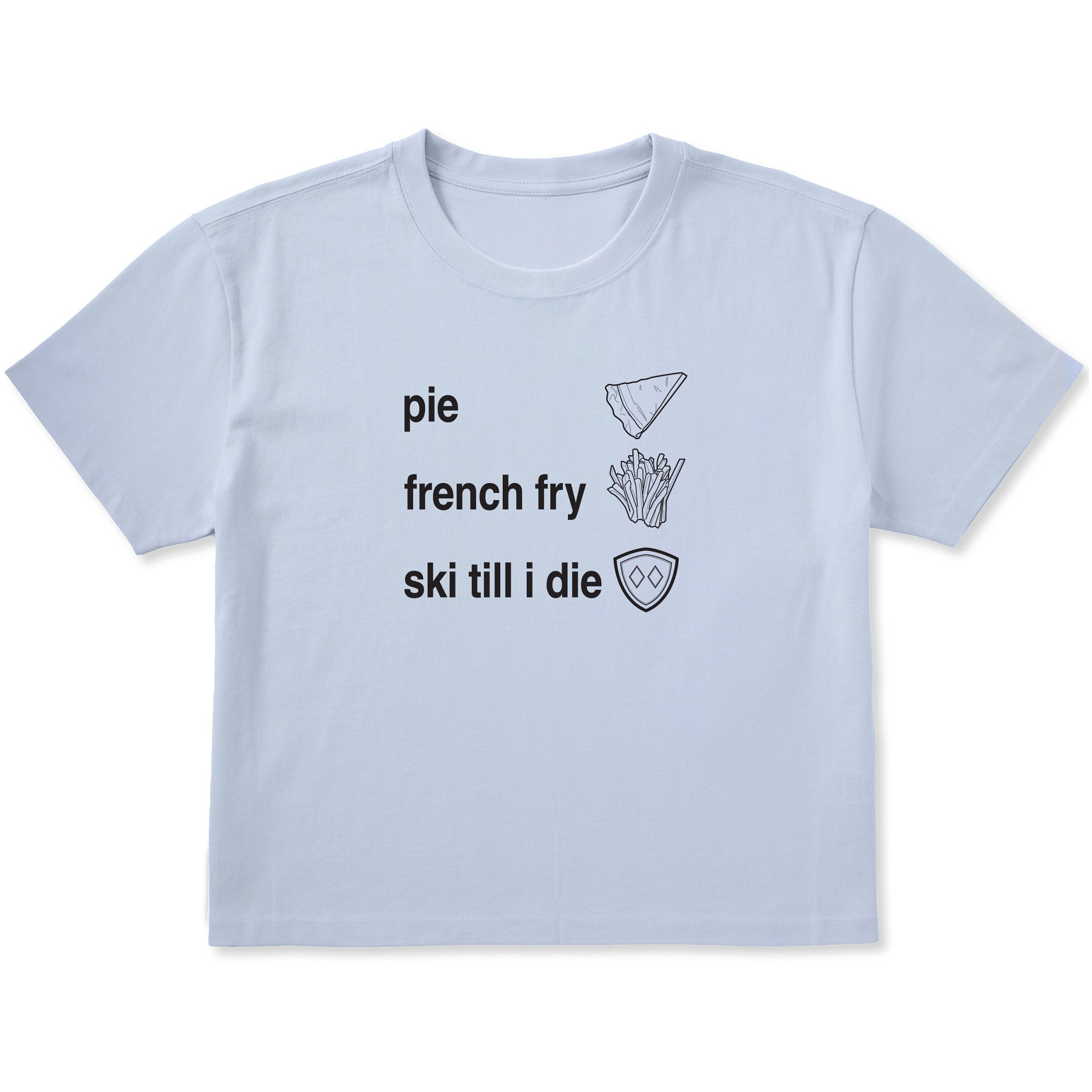 Light blue cropped T-shirt featuring black text and hand-drawn icons celebrating three mountain essentials: pie, French fries, and “Ski Till I Die,” finished with the signature Double Diamond shield.