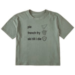 Sage green cropped T-shirt featuring black text and hand-drawn icons celebrating three mountain essentials: pie, French fries, and “Ski Till I Die,” finished with the signature Double Diamond shield.