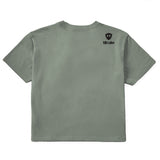 A sage green crop tee shirt shown from the back, featuring the double diamond shield logo and the text 'till i die' on the upper right shoulder, set against a plain white background.