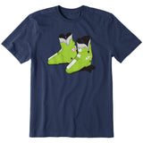 A navy short-sleeve crewneck t-shirt featuring a graphic print of a pair of lime green retro rear entry ski boots with white, black, and pink details.