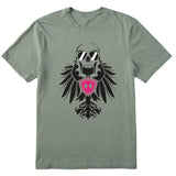 Light green short sleeve T-shirt featuring a bold black winged skull wearing sunglasses, finished with a bright pink Double Diamond shield at the center.