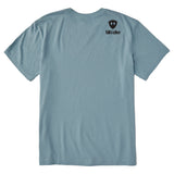 A light blue crewneck t-shirt shown from the back, featuring a double diamond shield and the brand name 'till i die' printed on the upper right back.