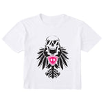 White cropped short sleeve T-shirt featuring a bold black winged skull wearing sunglasses, finished with a bright pink Double Diamond shield at the center.