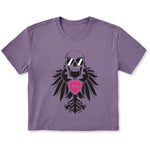 Faded purple cropped short sleeve T-shirt featuring a bold black winged skull wearing sunglasses, finished with a bright pink Double Diamond shield at the center.