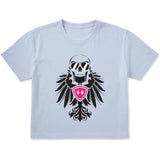Light blue cropped short sleeve T-shirt featuring a bold black winged skull wearing sunglasses, finished with a bright pink Double Diamond shield at the center.