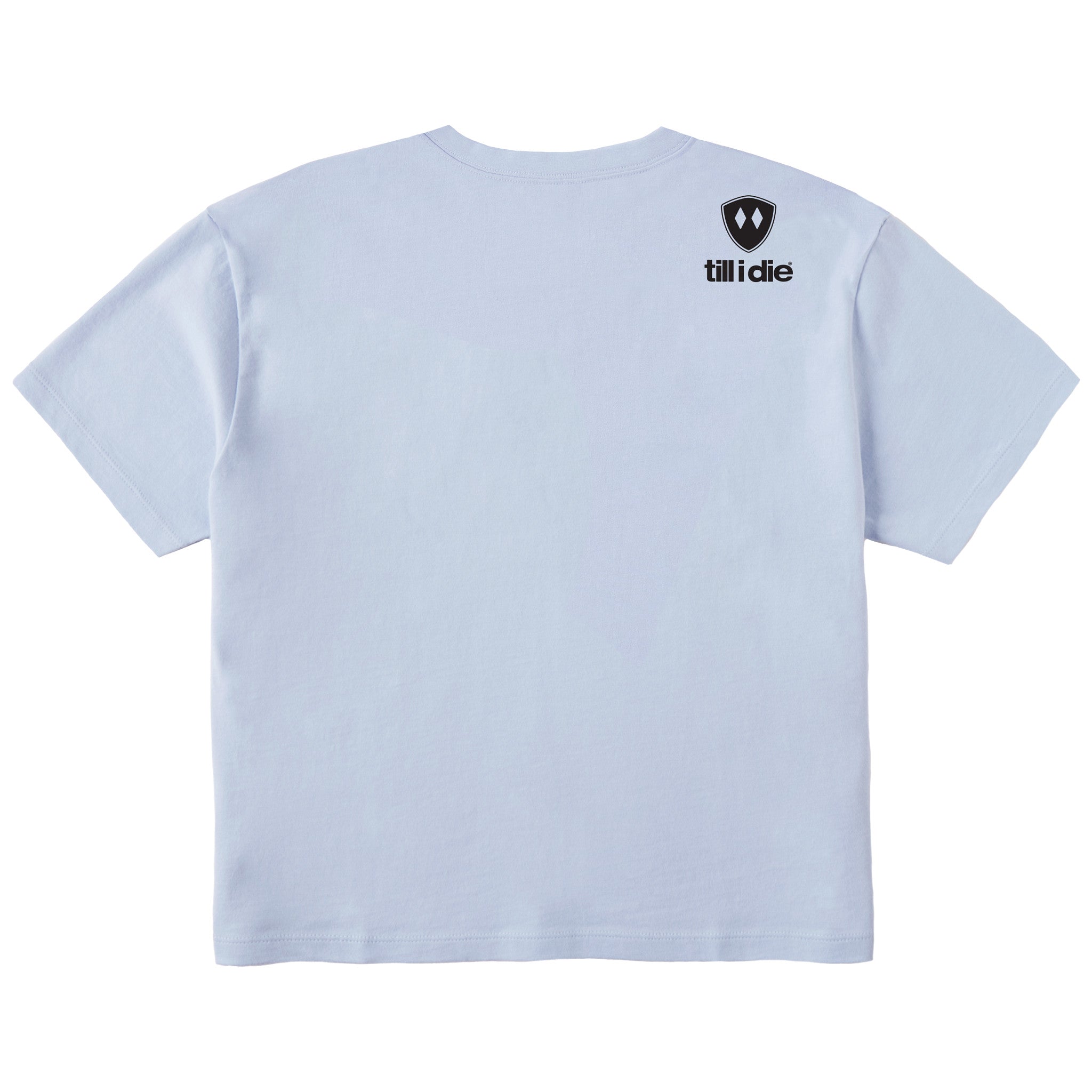 A light blue cropped tee shirt shown from the back, featuring the double diamond shield logo and the text 'till i die' on the upper right shoulder, set against a plain white background.