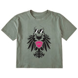 Military green cropped short sleeve T-shirt featuring a bold black winged skull wearing sunglasses, finished with a bright pink Double Diamond shield at the center.
