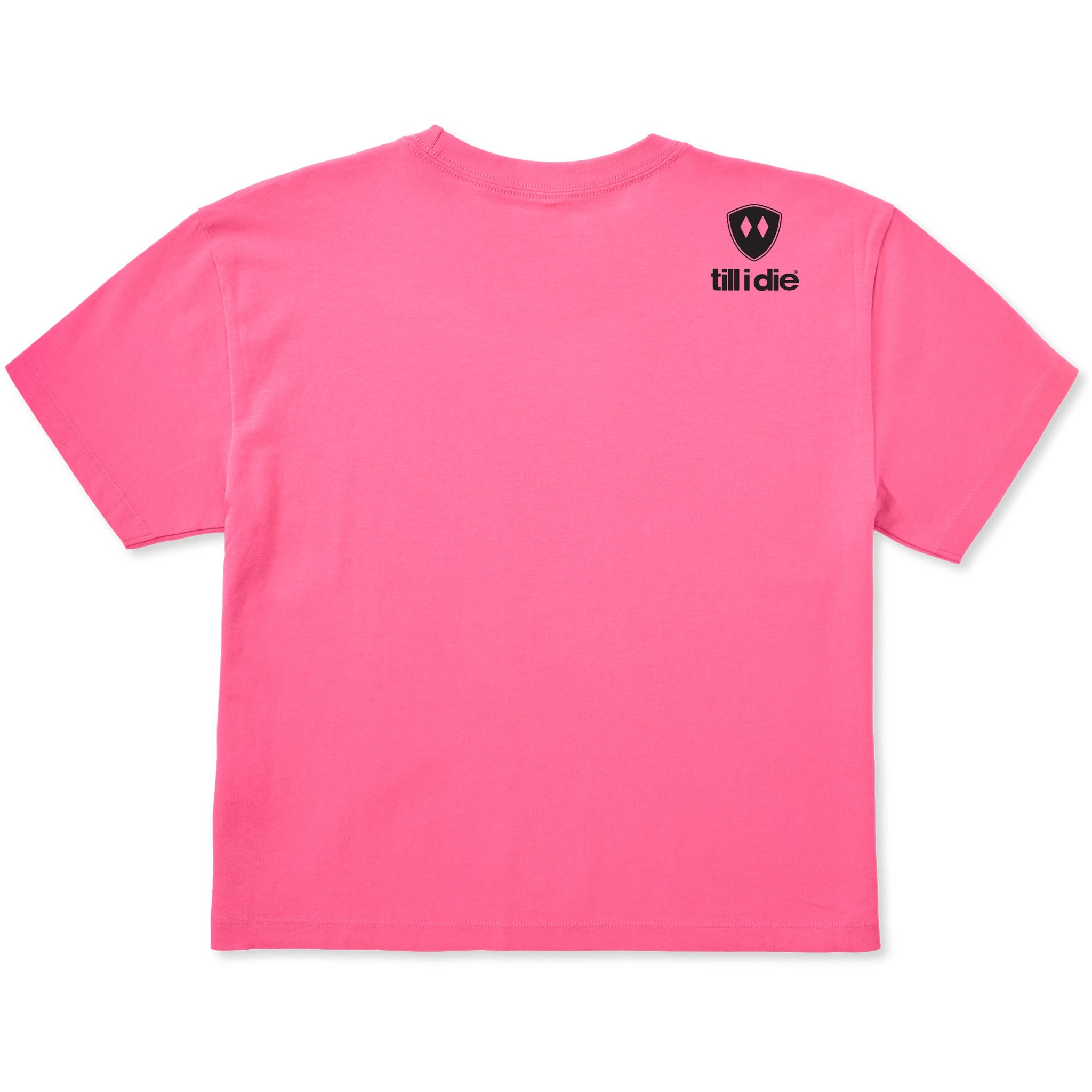 A bright pink cropped tee shirt shown from the back, featuring the double diamond shield logo and the text 'till i die' on the upper right shoulder, set against a plain white background.