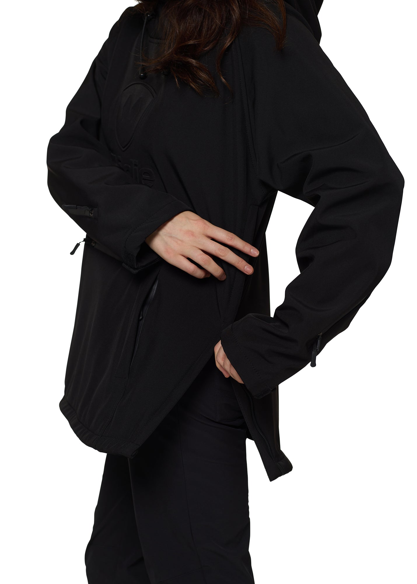 Model adjusting side zipper on black softshell pullover jacket