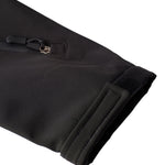 Close-up of left sleeve with Velcro cuff and zippered pass pocket