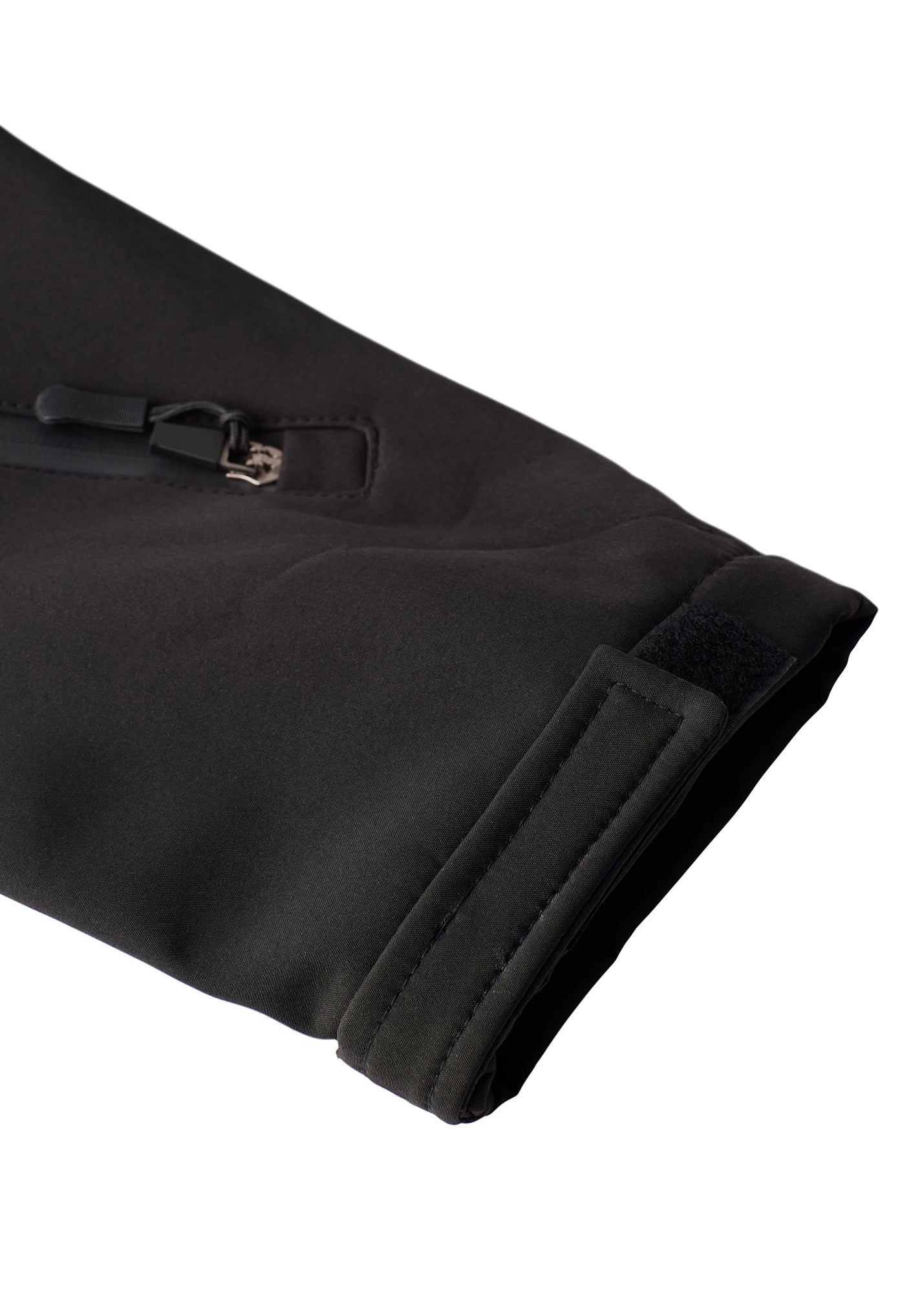 Close-up of left sleeve with Velcro cuff and zippered pass pocket