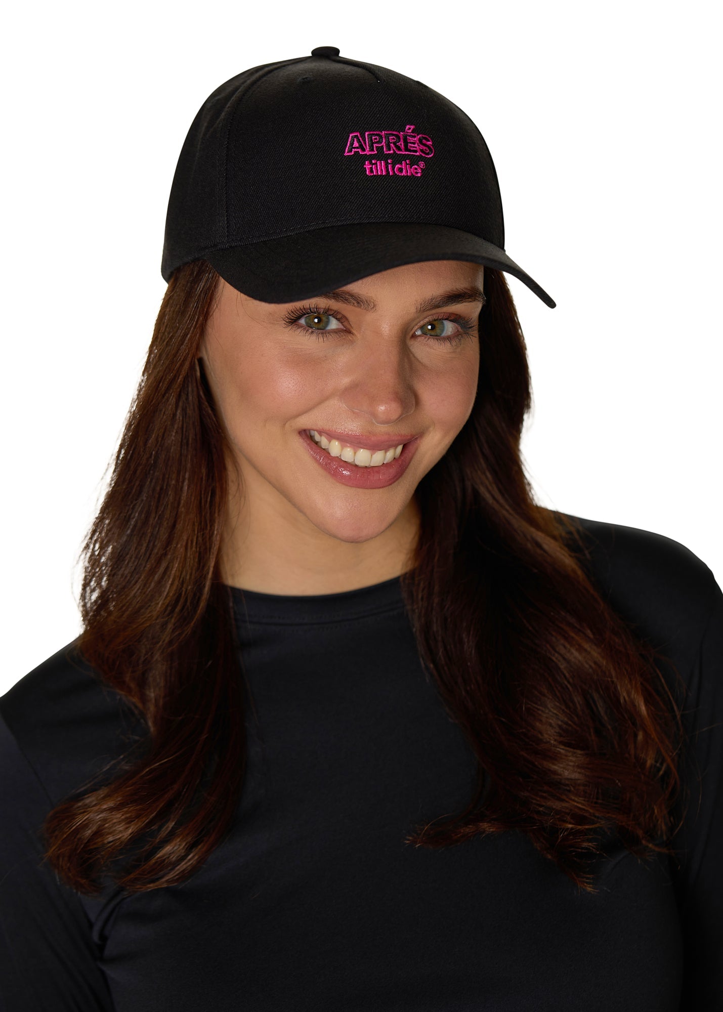 Female model wearing Apr�s Till I Die hat, smiling in a studio setting