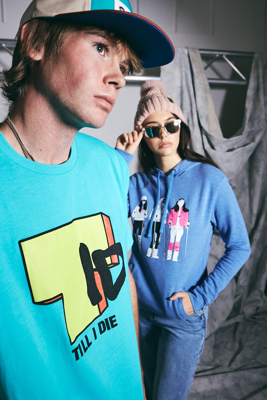 male and female model wearing till i die clothing in a studio setting