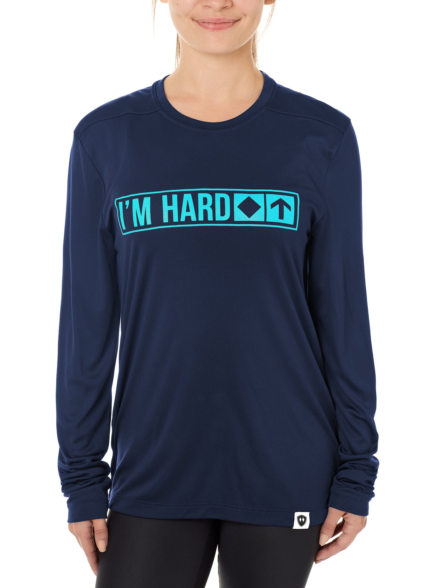 Front view of a female model wearing the "I'm Hard" Navy performance long sleeve Shirt. The graphic features trail sign-inspired "I'm Hard" text with a single diamond symbol indicating advanced terrain.