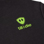 Detail of lime green trail sign graphic on Till I Die "I'm Hard" hoodie, Winter 2025