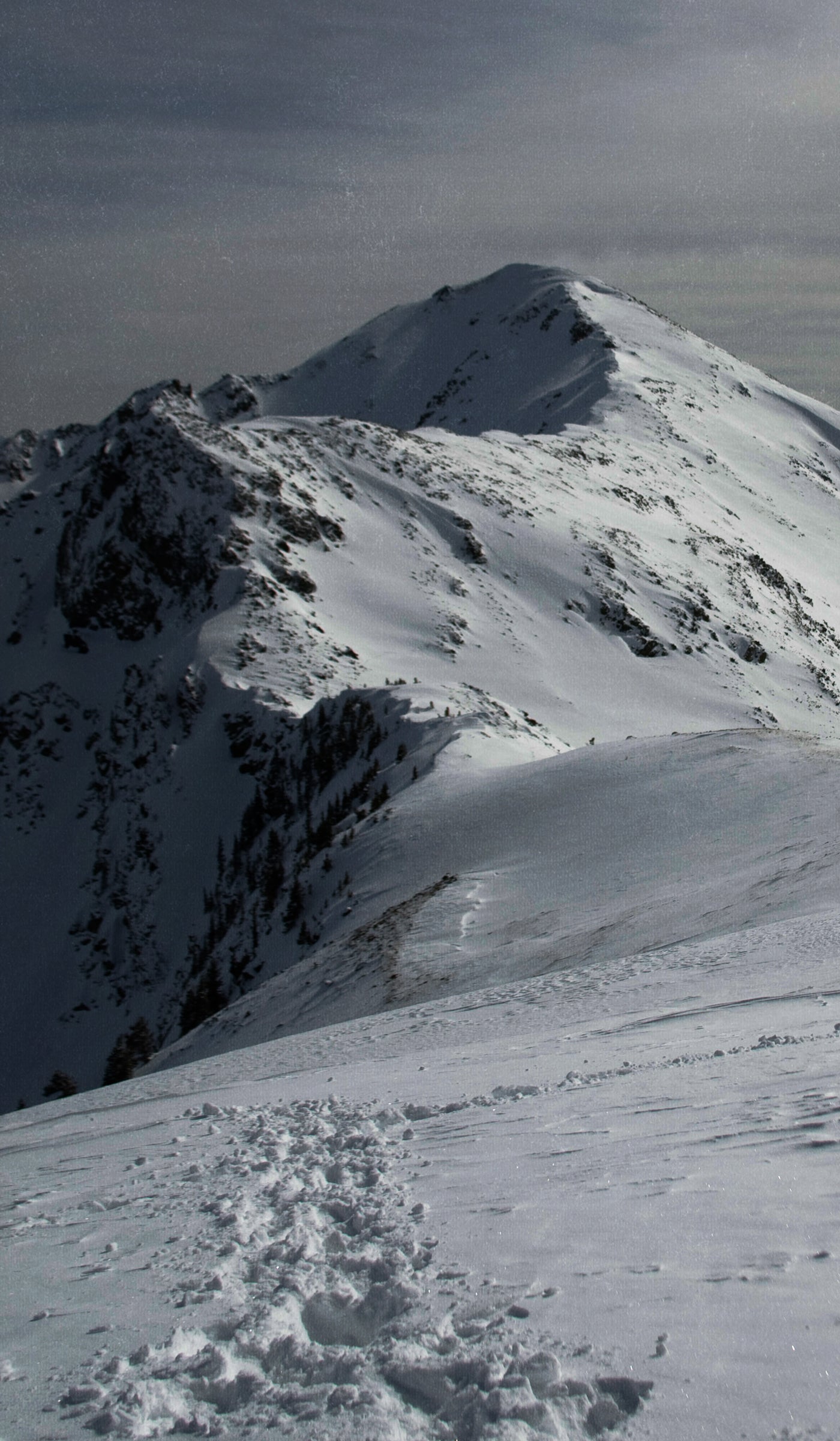 Winding summit of a snowy mountain ridge