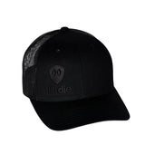 Flat lay of the Till I Die Black-on-Black Trucker Hat, showcasing the stacked logo and Double Diamond Shield in puff embroidery.
