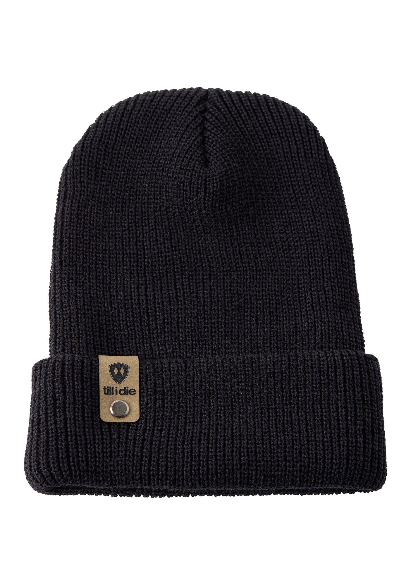 Flat lay of the Till I Die black knit beanie showing  the medium gauge knit and branded leather logo tab on the cuff