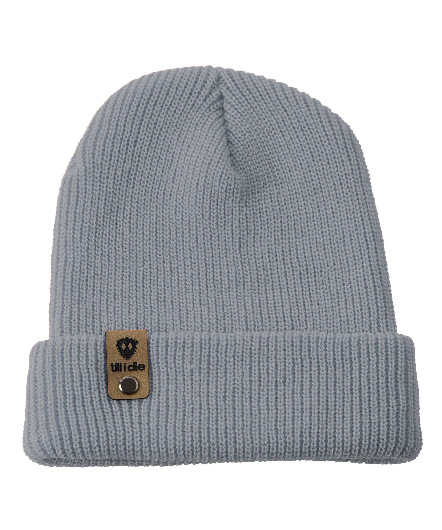 Flat lay of the Till I Die cadet bluel knit beanie showing  the medium gauge knit and branded leather logo tab on the cuff