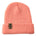 Flat lay of the Till I Die coral knit beanie showing  the medium gauge knit and branded leather logo tab on the cuff