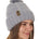 side view of a female model wearing a gray knit pom beanie featuring a matching pom pom, cuff and leather till i die logo tab with a nickel fastener.