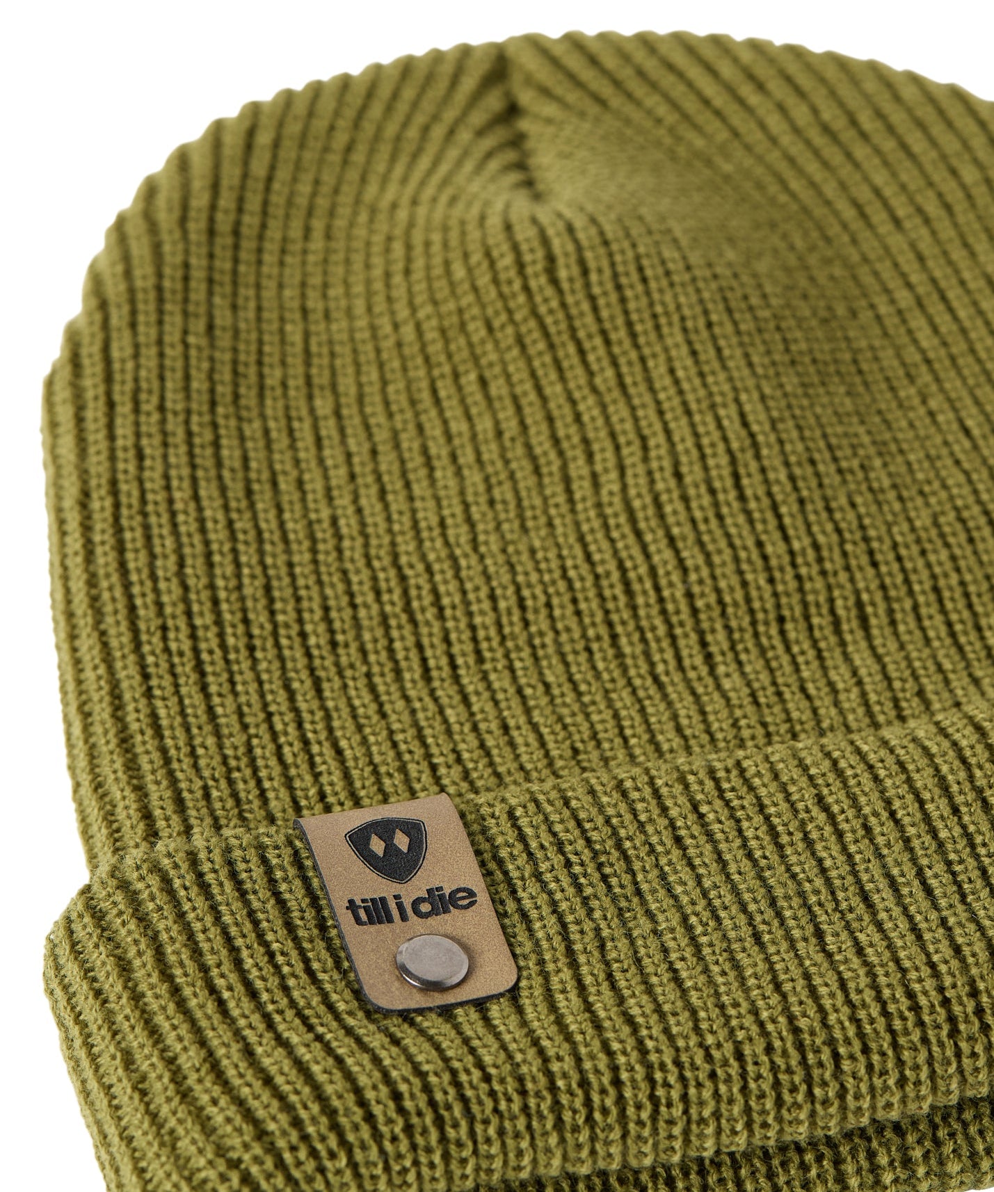 Flat lay of the Till I Die military green  knit beanie showing close-up detail of the medium gauge knit and branded leather logo tab on the cuff