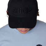 Male model wearing black Till I Die Puffer Hat with tone-on-tone puff embroidery and wool blend texture