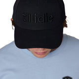 Male model wearing black Till I Die Puffer Hat with tone-on-tone puff embroidery and wool blend texture