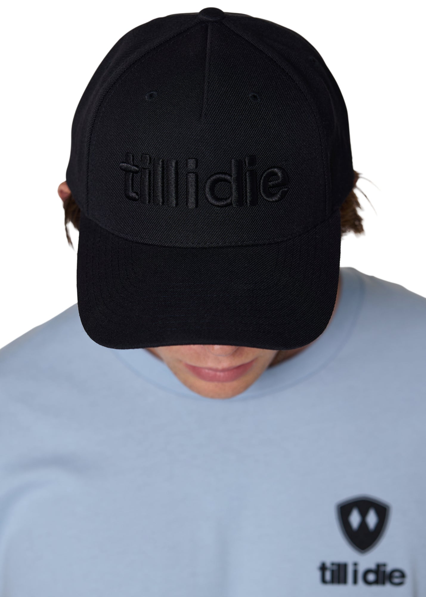 Male model wearing black Till I Die Puffer Hat with tone-on-tone puff embroidery and wool blend texture