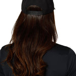 Back view of female model showing adjustable snapback strap