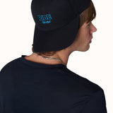 Male model wearing Ride Till I Die hat backwards with logo visible