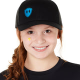 Front view of a youth wearing a black classic trucker hat with a blue embroidered double diamond shield on the bottom right panel