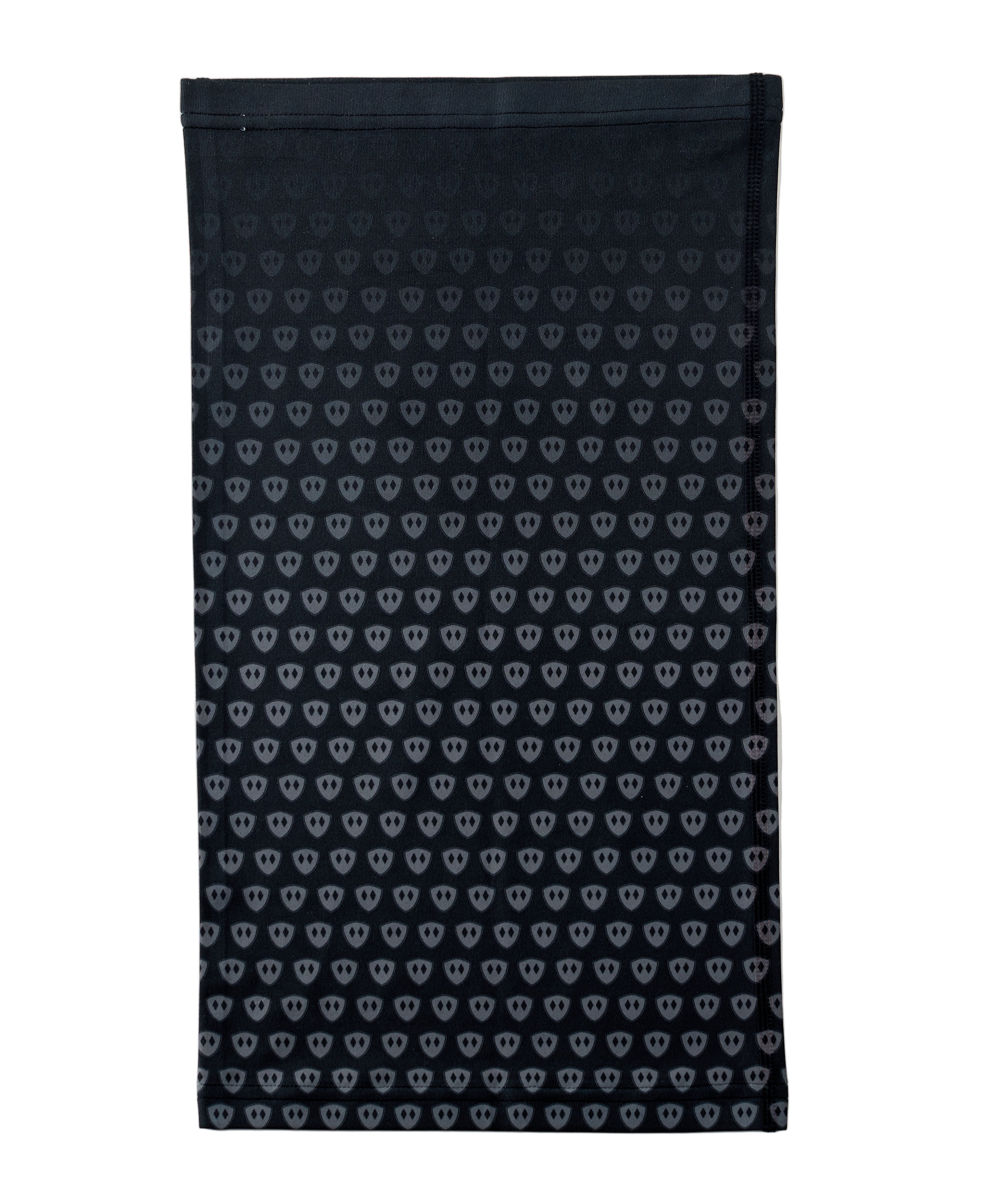 Overhead flat lay image of the back side of a black neck gaiter featuring a repeating dark gray diamond-shield pattern. The gaiter is placed on a white background.