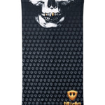 Overhead flat lay image of a black neck gaiter featuring a repeating dark gray diamond-shield pattern. The top portion shows a white skull graphic with gold teeth, and the bottom right corner displays a gold Till I Die logo. The gaiter is laid flat on a white background.