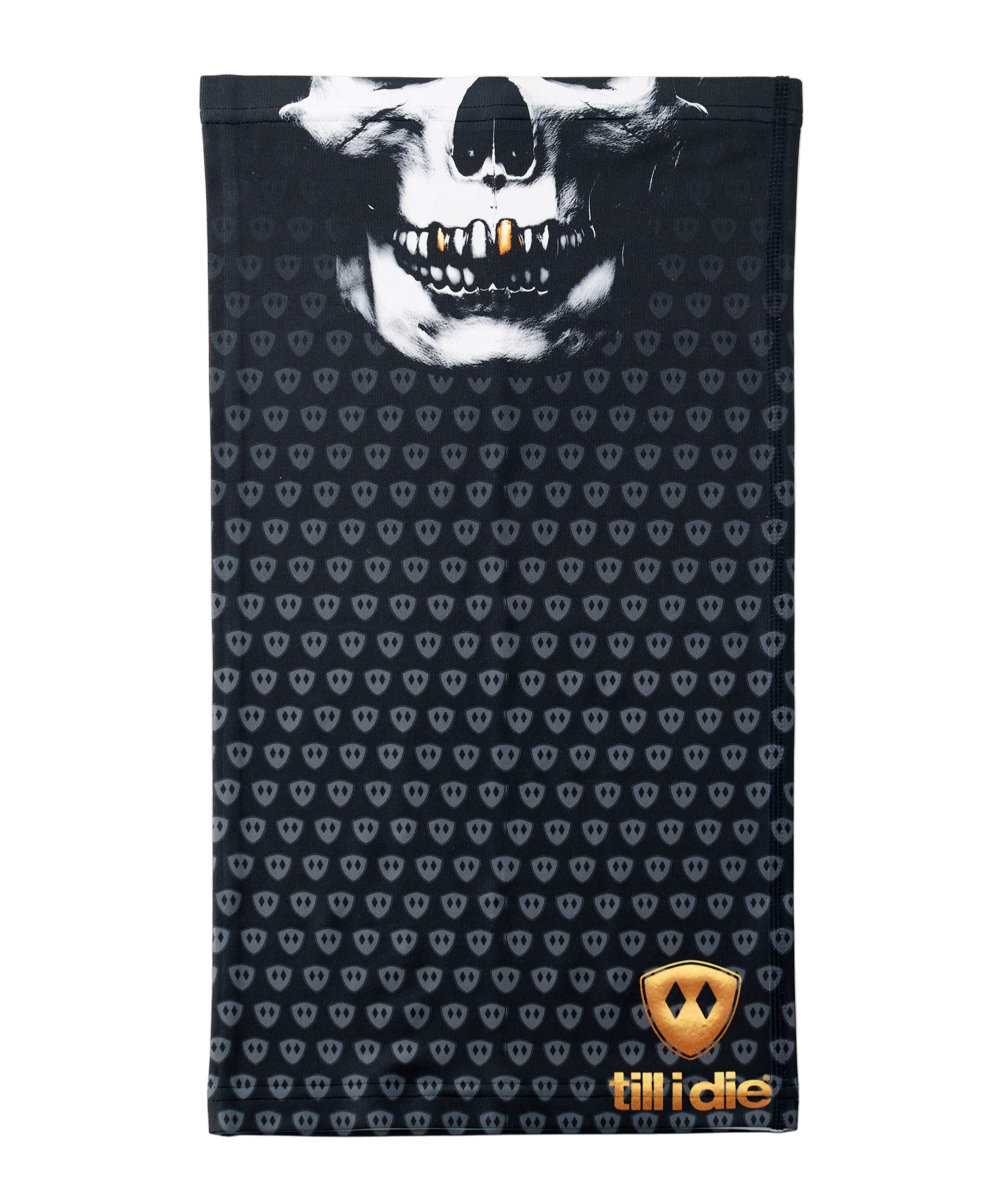 Overhead flat lay image of a black neck gaiter featuring a repeating dark gray diamond-shield pattern. The top portion shows a white skull graphic with gold teeth, and the bottom right corner displays a gold Till I Die logo. The gaiter is laid flat on a white background.