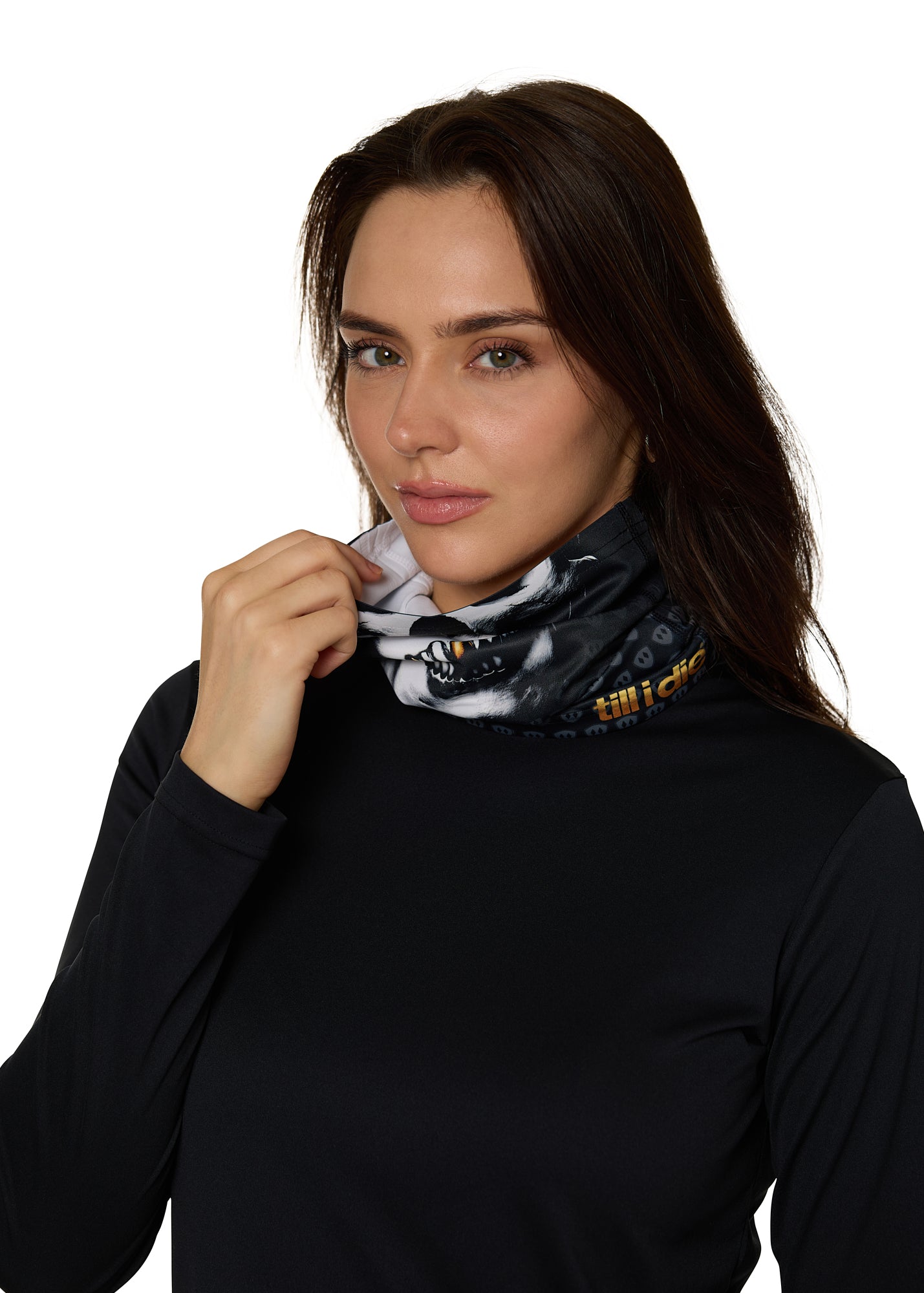 Female model wearing the Skeleton Neck Gaiter, shown covering her neck as she holds it up toward her face.