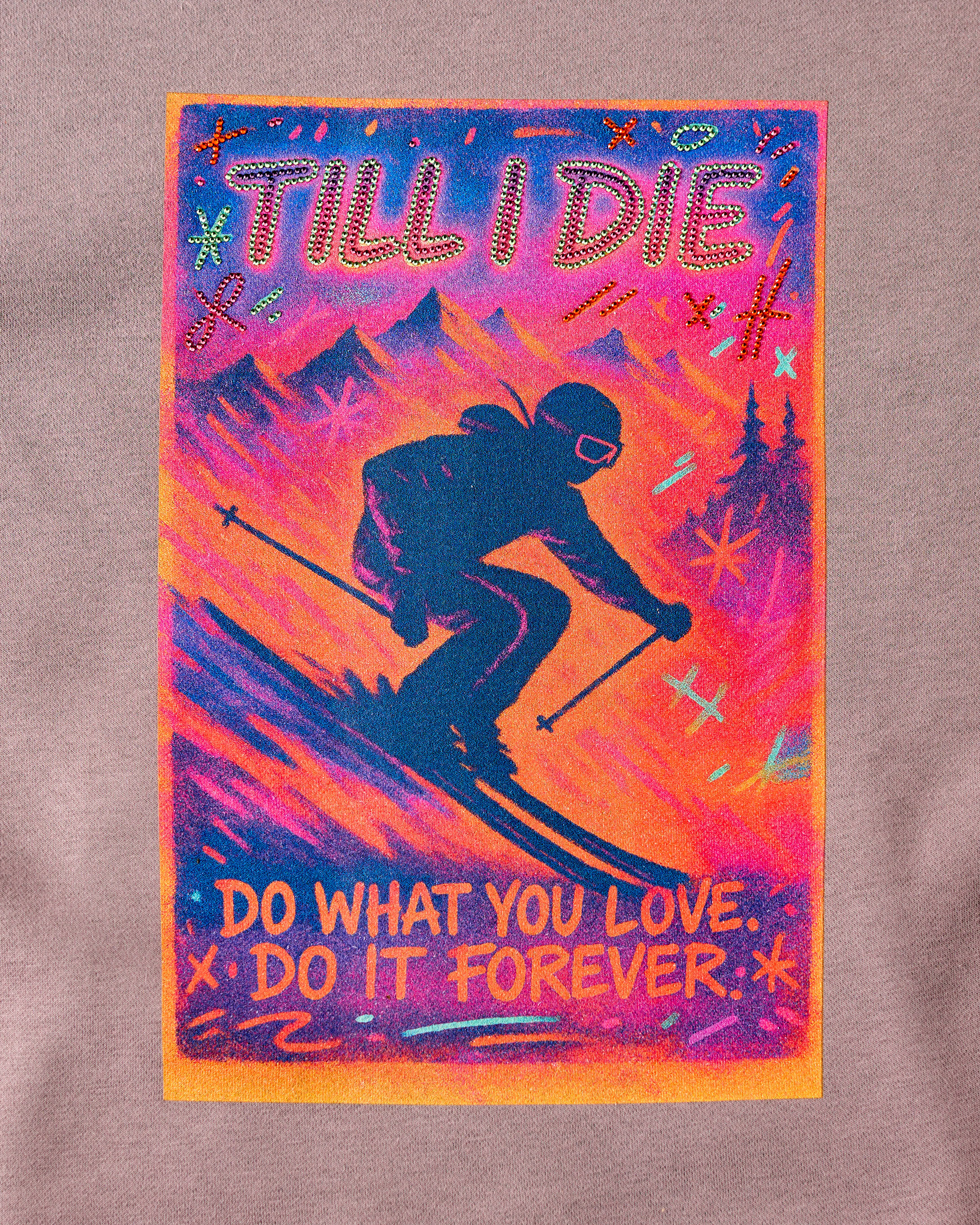 Back graphic of Ski Till I Die hoodie in Shiitake with rhinestones and mountain scene, Winter 2025
