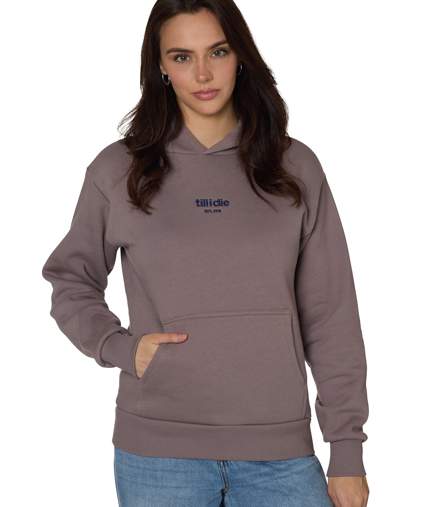 Female model in Ski Till I Die Rhinestone hoodie in Shiitake brown, front view with Till I Die and Established date 2010 in Sapphire metallic embroidery, Winter 2025 collection