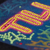 Back graphic on Snowboard Till I Die hoodie with rhinestone embellishments, Winter 2025