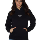 Female model wearing Snowboard Till I Die Rhinestone hoodie in black, front view, Winter 2025 collection