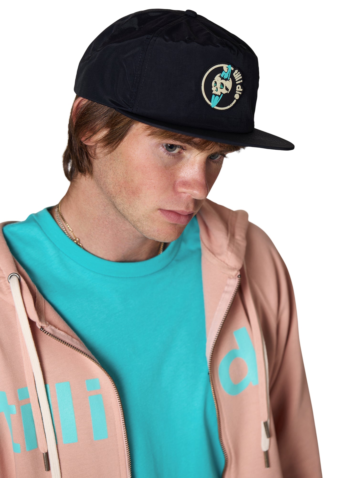 Model wearing a black surf hat with a Till I Die logo zip up hoodie in Rose with a Tahiti Blue shirt.
