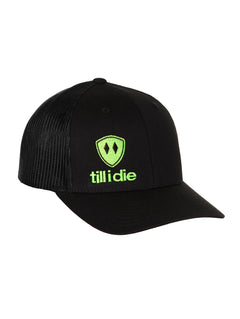 Front view of a black classic trucker hat, featuring a green embroidered Till I Die logo with double black diamonds and a green shield on the lower right front panel on a white background.