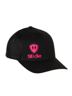 Front view of a black classic trucker hat, featuring a hot pink embroidered Till I Die logo with double black diamonds and a hot pink shield on the lower right front panel on a white background.