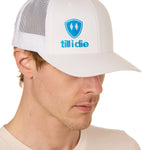 Front view of a male model wearing a white classic trucker hat, featuring a blue embroidered Till I Die logo on the lower right front panel.