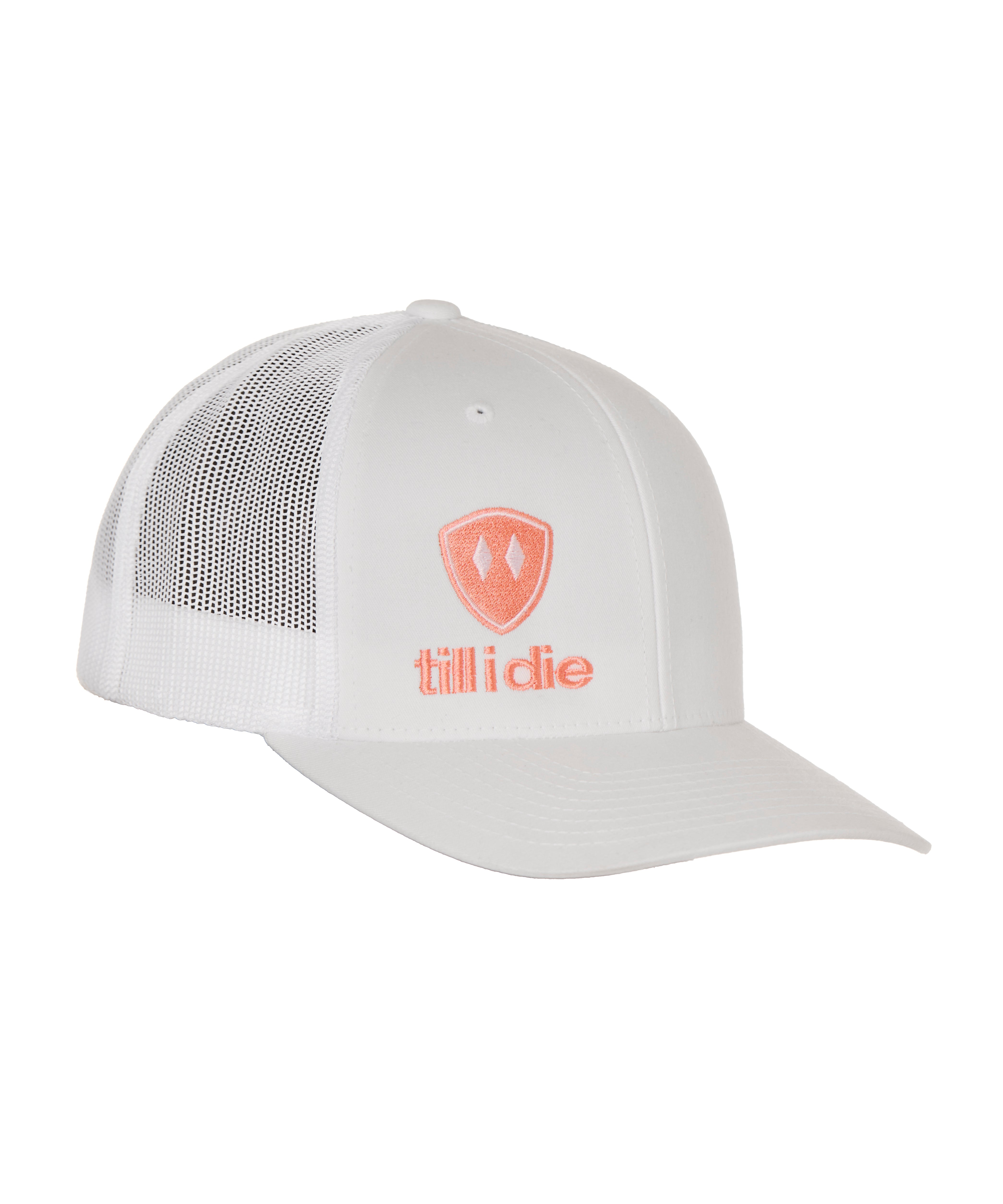 Front view of a white classic trucker hat, featuring a coral embroidered Till I Die logo with double white diamonds and a coral shield on the lower right front panel on a white background.