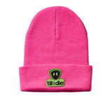 Bright pink cuffed beanie displayed on a white background, featuring a soft chenille patch of the Till I Die logo in lime green and black with the double diamond shield.