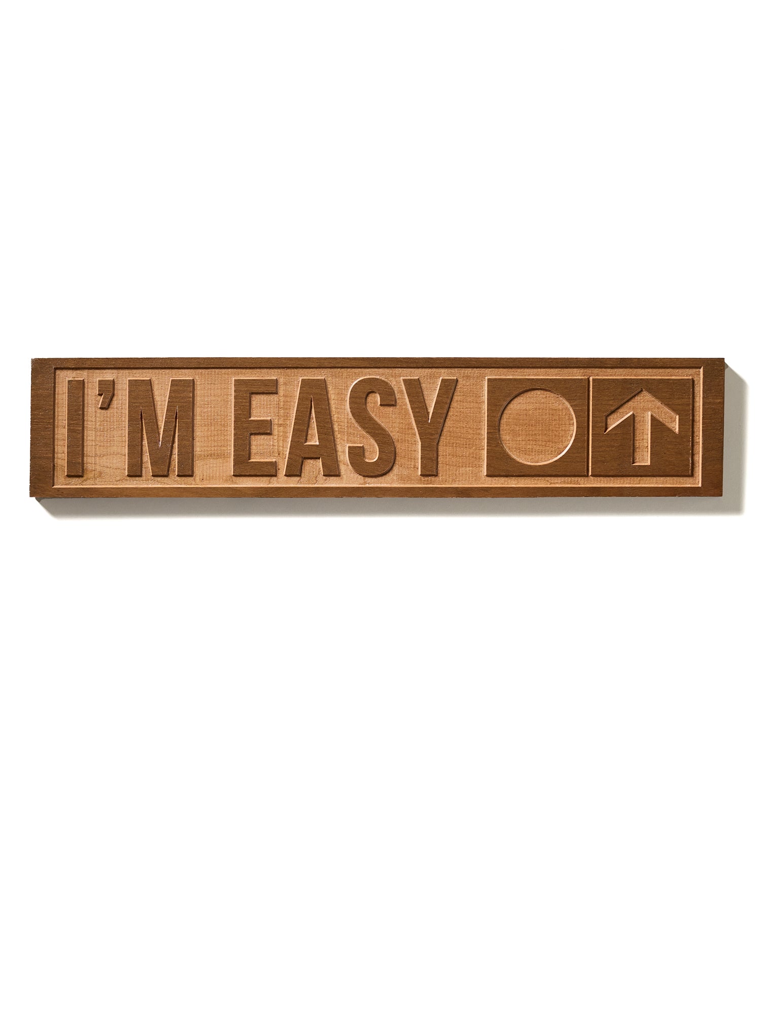 The “I’m Easy” ski trail sign shown on a white background, featuring natural cherry wood with visible grain. The design includes a circle and an upward-pointing arrow.